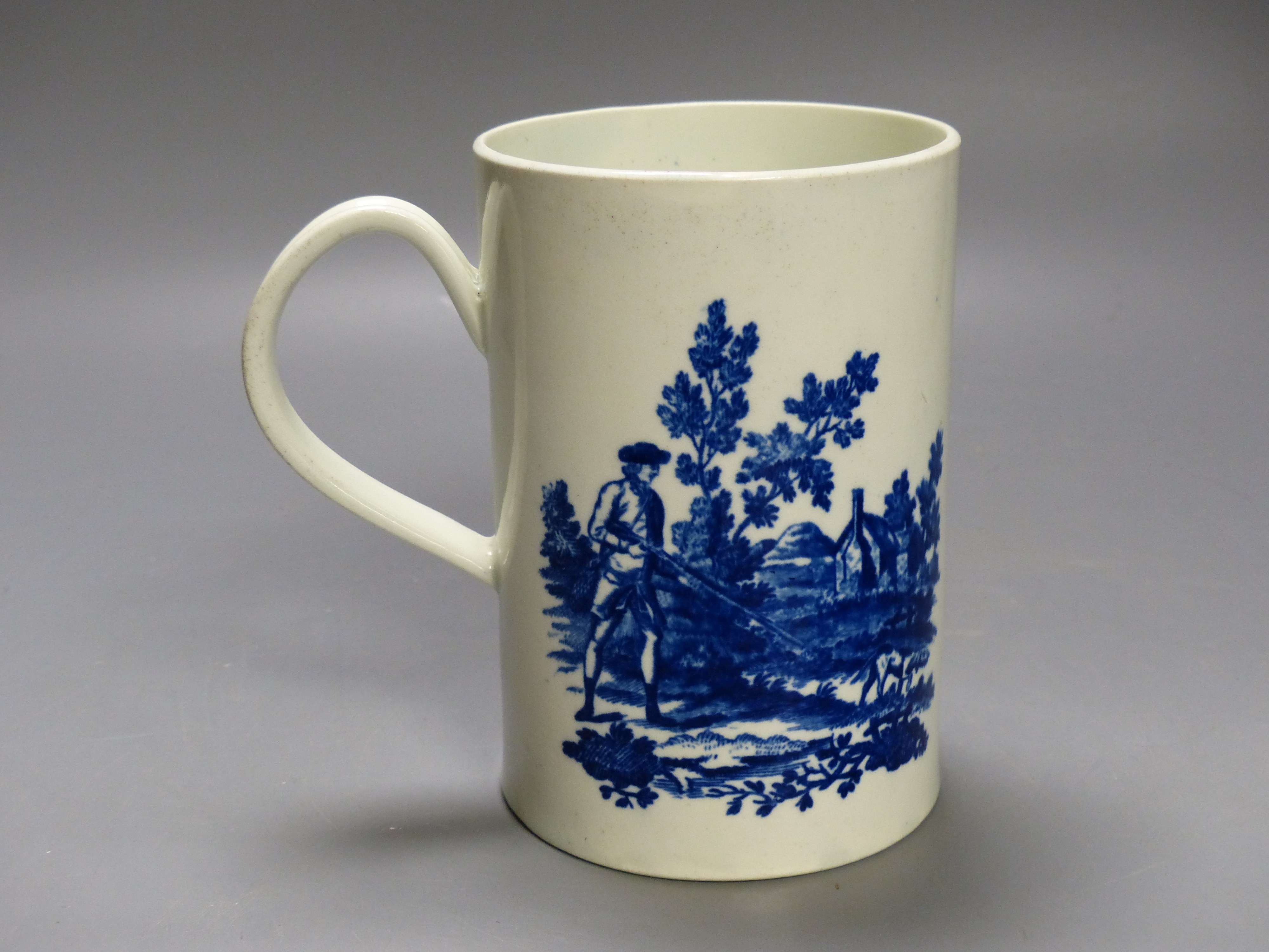 A Worcester 'Man holding gun' and 'Man shooting gun' patterns cylinder mug. Printed, shaded crescent mark, height 14cm